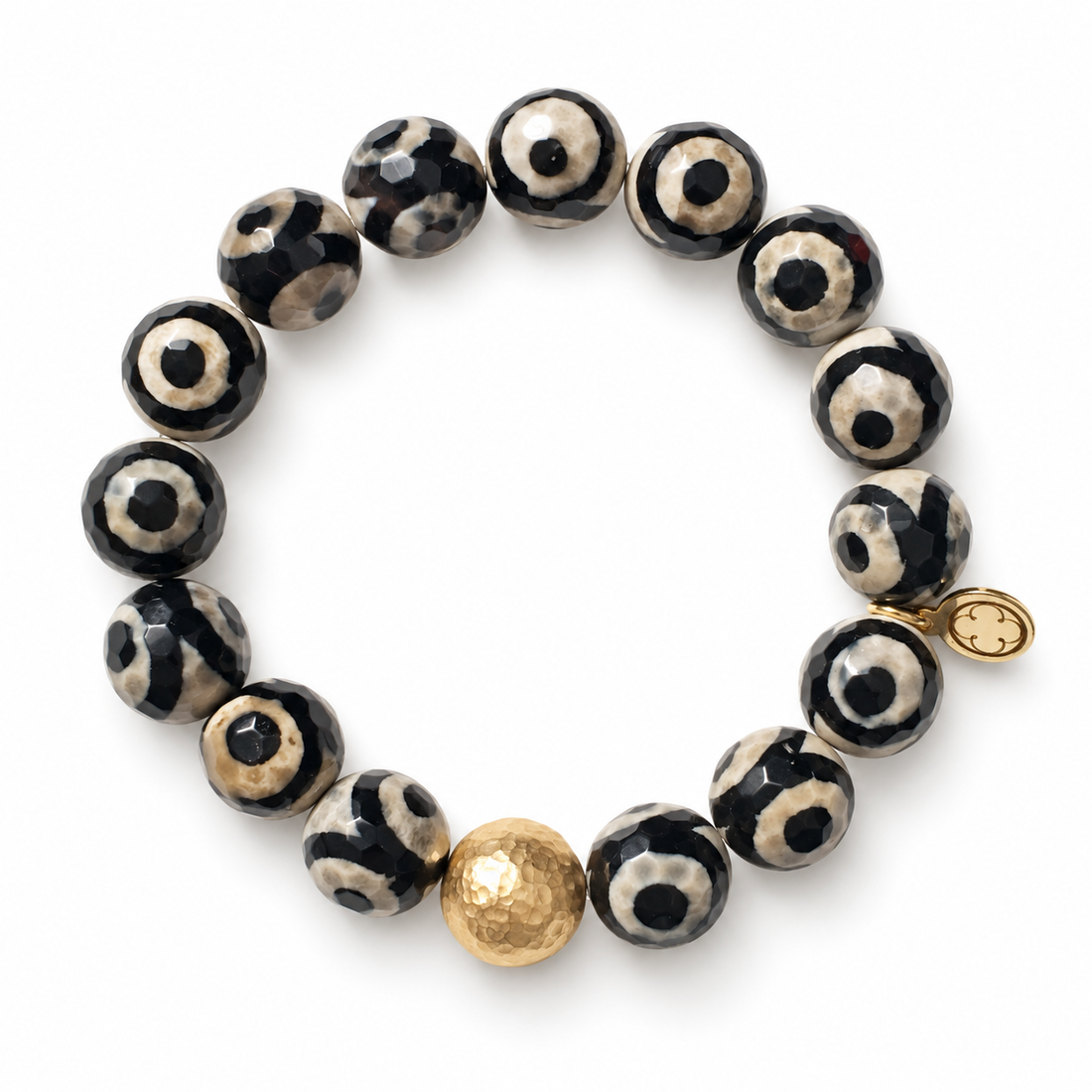 Tibetan Black Eye Agate with Hammered Gold Accent on a white background