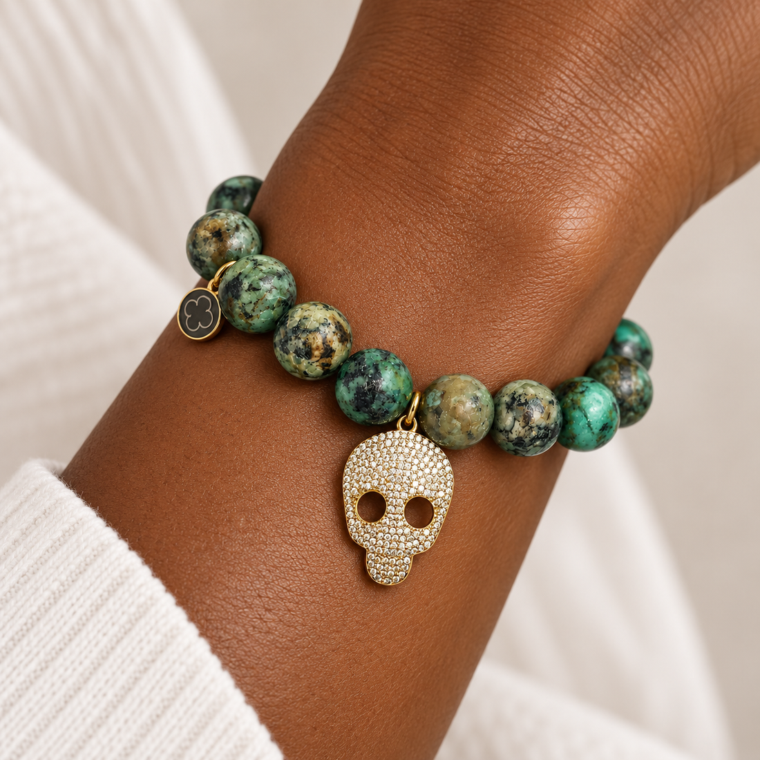African Turquoise with Pavé Gold Skull on a woman&