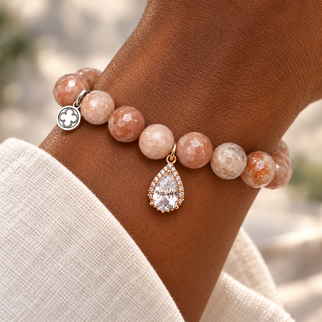 Desert Moonstone with Pavé Rose Gold Teardrop Pendant on a woman’s wrist