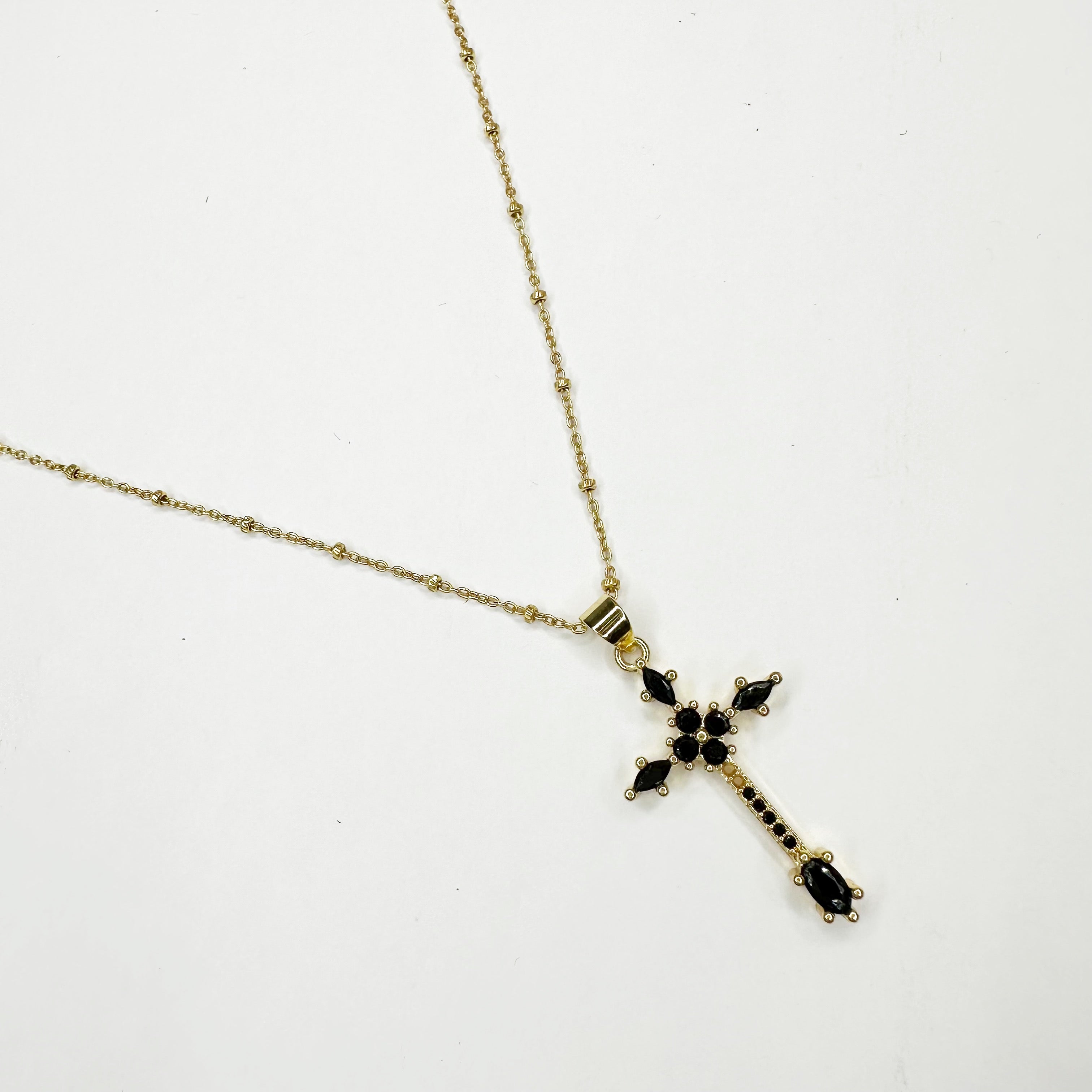 Pavé cross necklace online with black diamonds