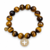 Tiger Eye with Pavé Gold Signature Logo on a white background