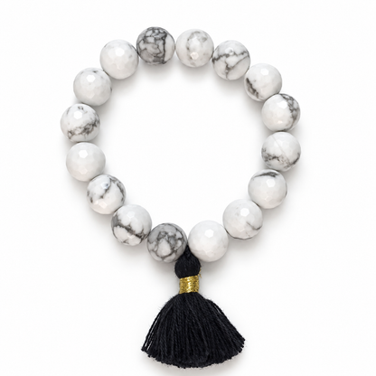 White Howlite with Black Tassel on a white background