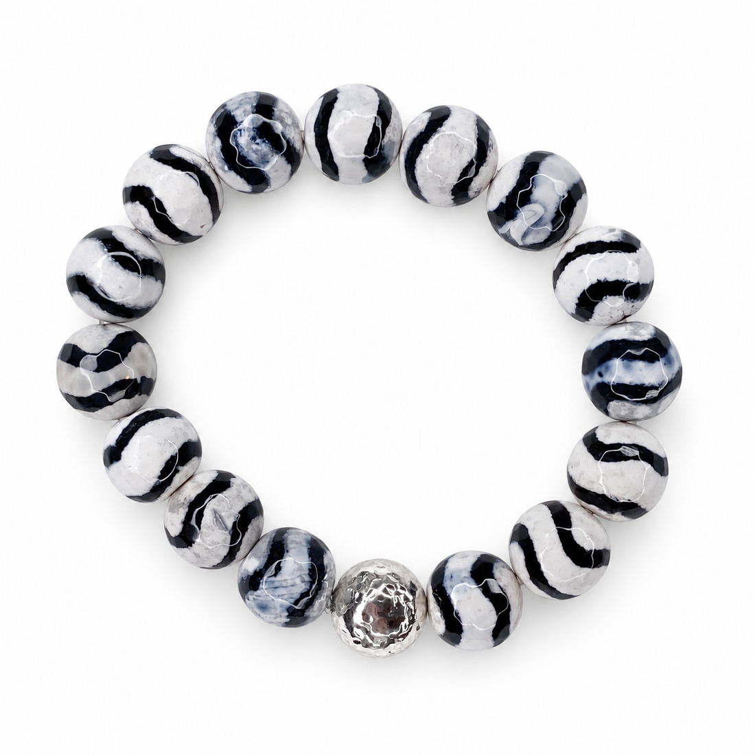 Tibetan Black Wave Agate with Silver Hammered Accent on white studio background