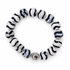 Tibetan Black Wave Agate with Silver Hammered Accent on white studio background
