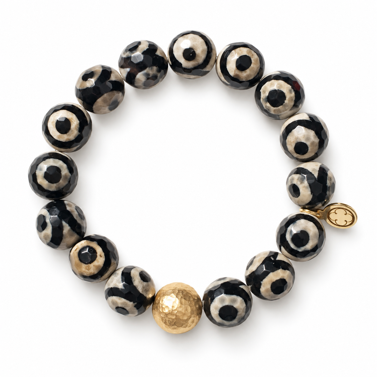 Tibetan Black Eye Agate with Hammered Gold Accent on a white background