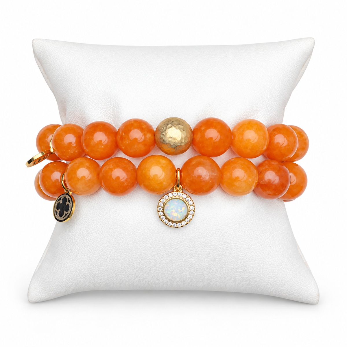 Orange Jade Color Stax bracelet set on white display pillow