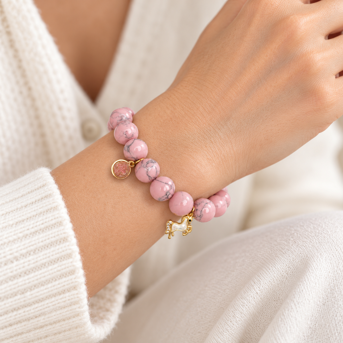 Be Yourself, Unless You Can Be A Unicorn Light Pink Howlite bracelet on a woman&