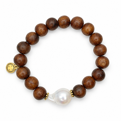 Date Wood with Large Baroque Freshwater Pearl on white studio background