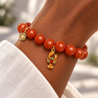 Fire Jade with Pavé Lobster Pendant on a woman’s wrist