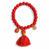 Orange Howlite with Orange Tassel on white studio background