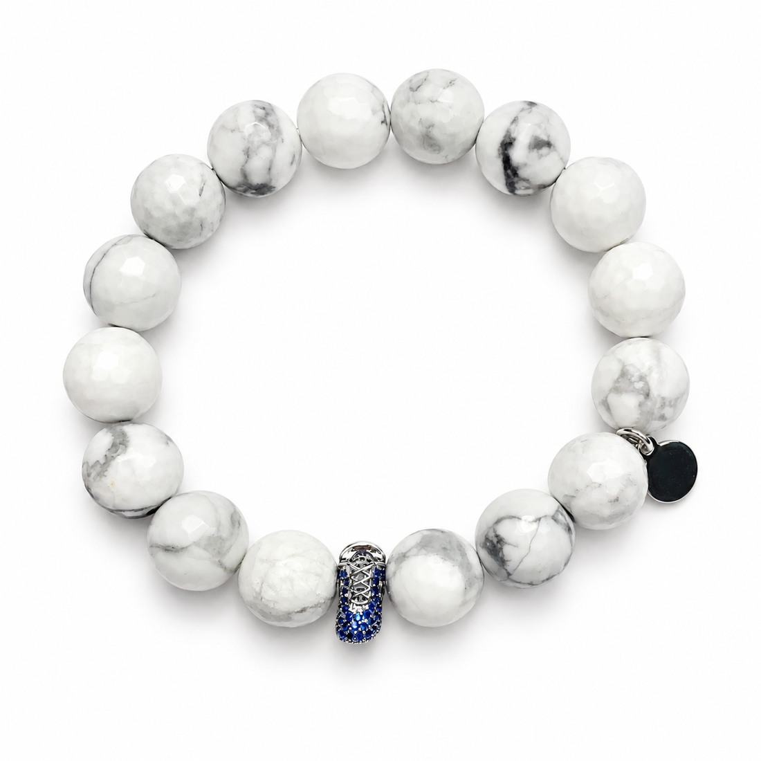 White Howlite with Blue Baby Shoe Accent Bead on white studio background