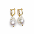Molten Mother of Pearl with Gold Baroque Pearl Earring on a white studio background