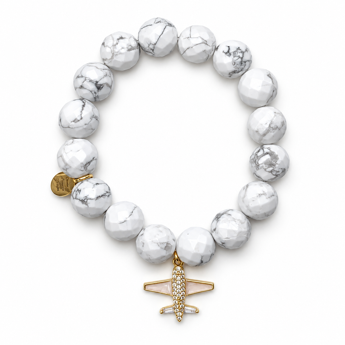 White Howlite with Gold Pavé Airplane on white studio background