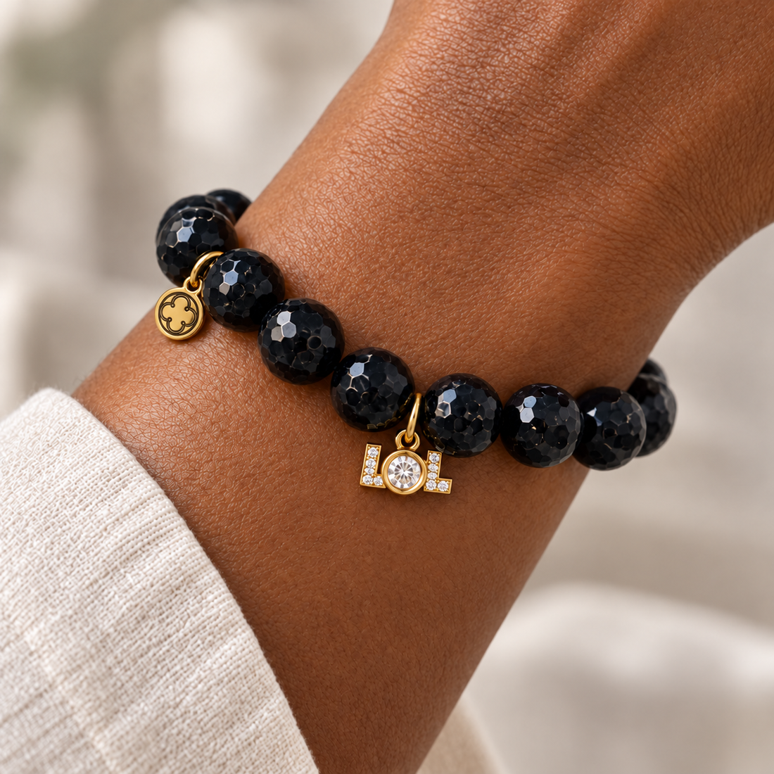 Black Onyx with Pavé LOL pendant worn on a woman&