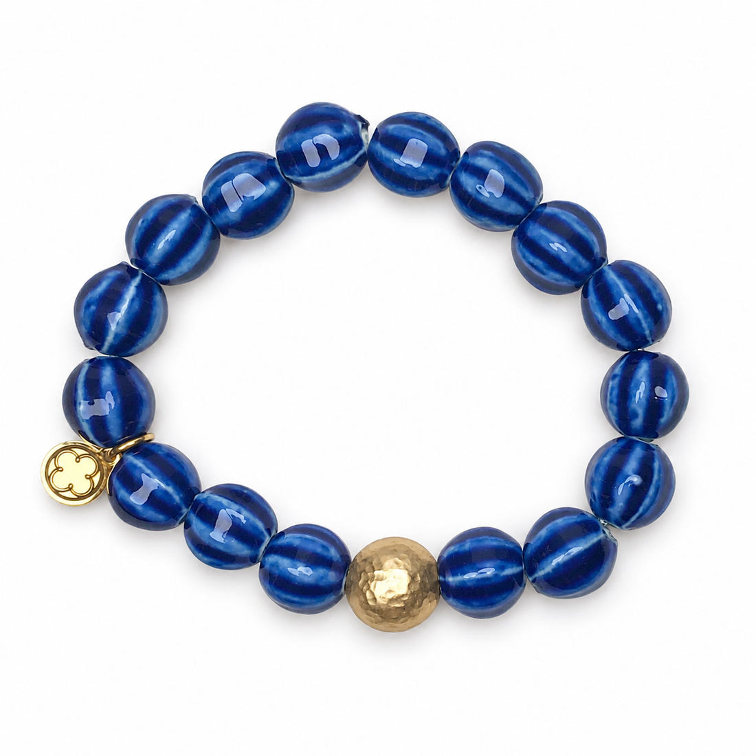 Blue Ceramic Riccio Bead with Hammered Gold Accent on white studio background