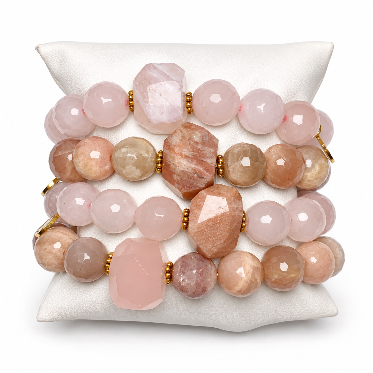 Rose Quartz &amp; Desert Moonstone Rock Candy Armparty on white studio background