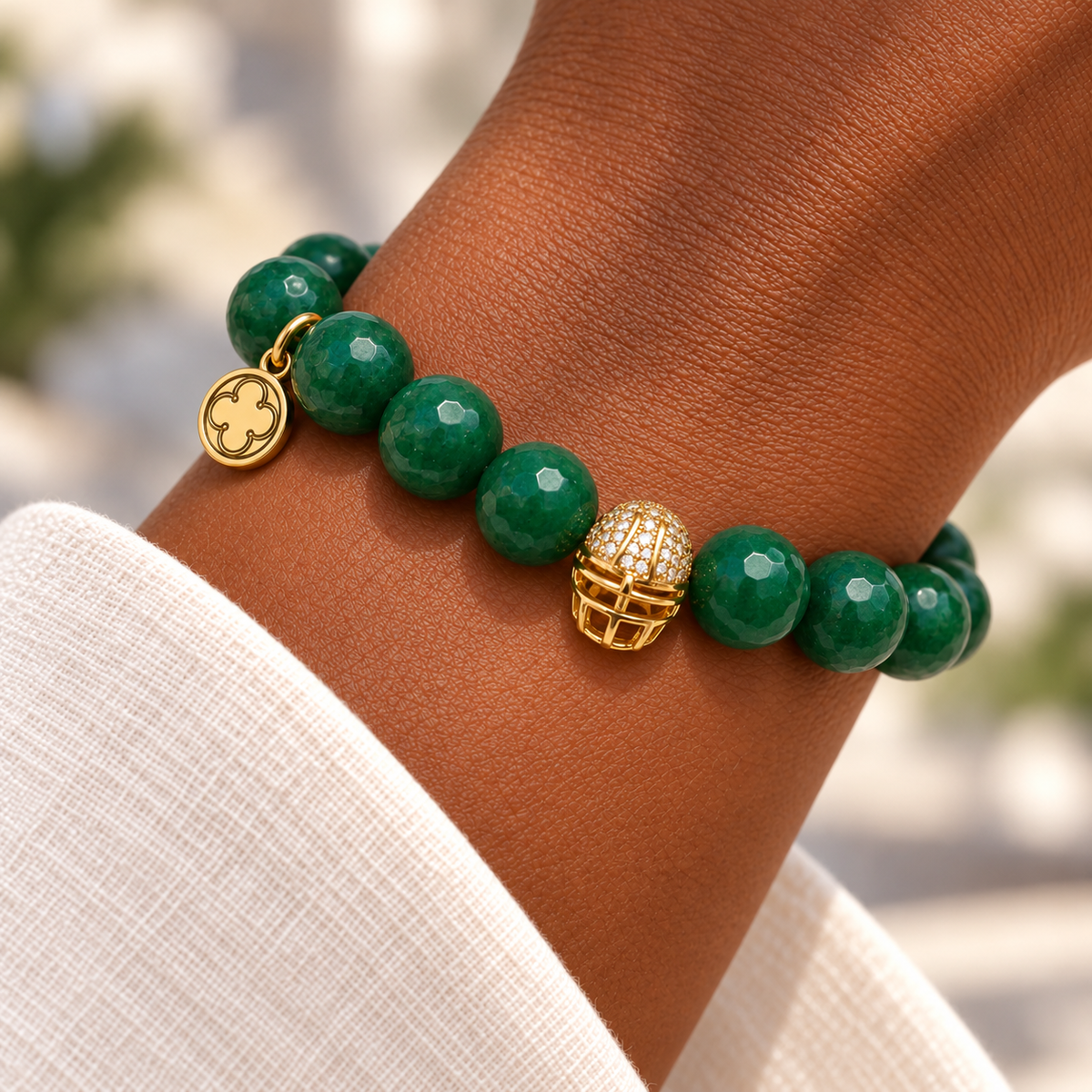 Emerald Green Jade with Pavé Gold Helmet on a woman’s wrist