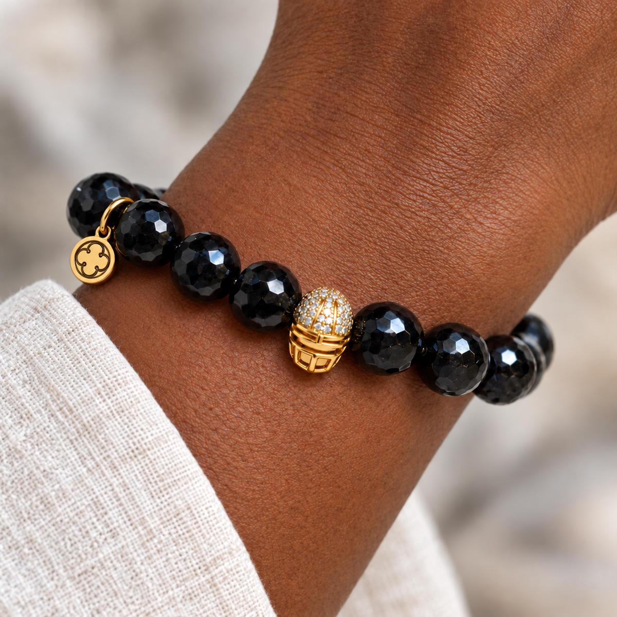 Black Onyx with Pavé Gold Helmet worn on a woman&