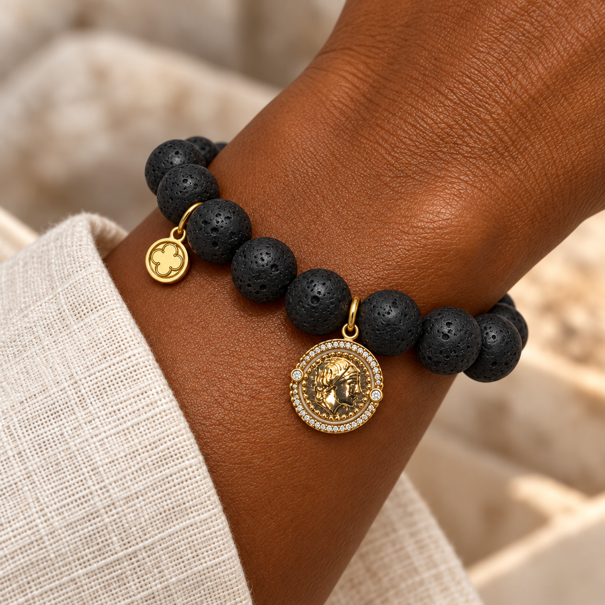 Black Lava with Roman Coin bracelet worn on a woman&