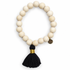 Blonde Wood with Black Tassel on white studio background