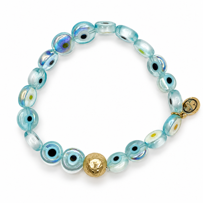Blue Iridescent Evil Eye Glass with Hammered Gold Accent on white studio background