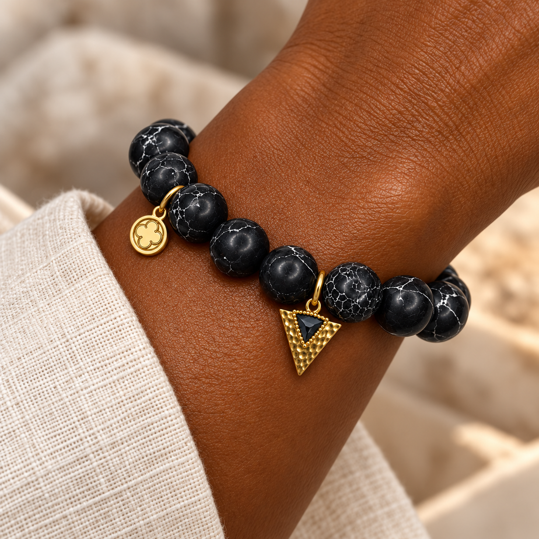 Black Howlite with Black Dagger Pendant bracelet worn on a woman&
