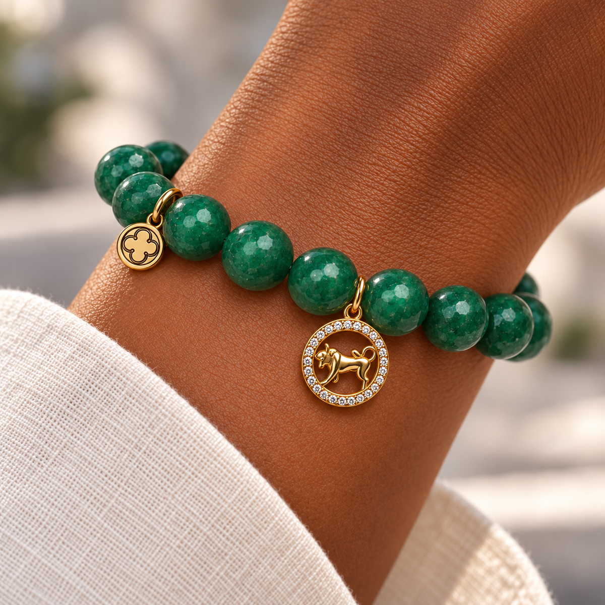 Emerald Jade with Taurus Zodiac Pendant on a woman’s wrist