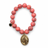 Coral Howlite with St. Anthony Pendant on white studio background