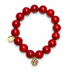 Red Howlite "One Dog At A Time" with Dog Paw Pendant on white studio background