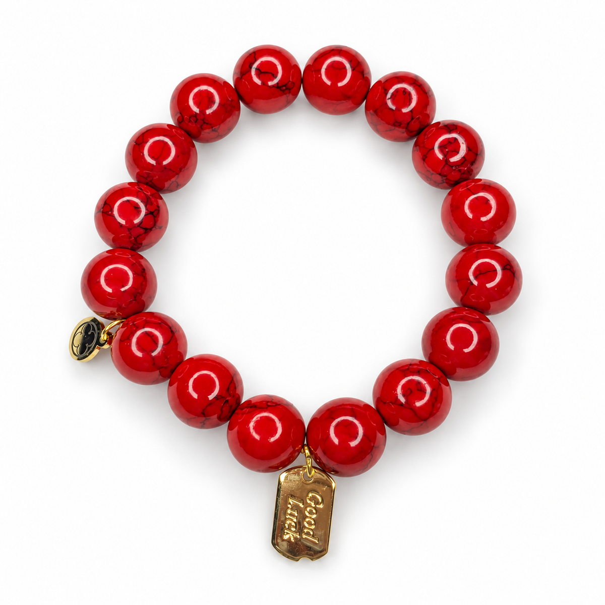 Red Howlite with Good Luck Pendant on a white background