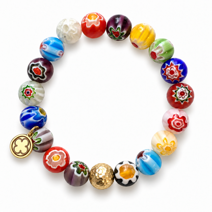 Millefiore with Hammered Gold Accent with signature logo tag between the third and fourth beads