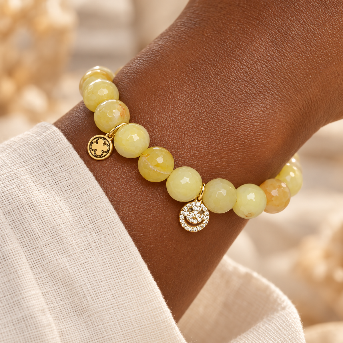 "Smile, Be Happy" Yellow Agate worn on wrist
