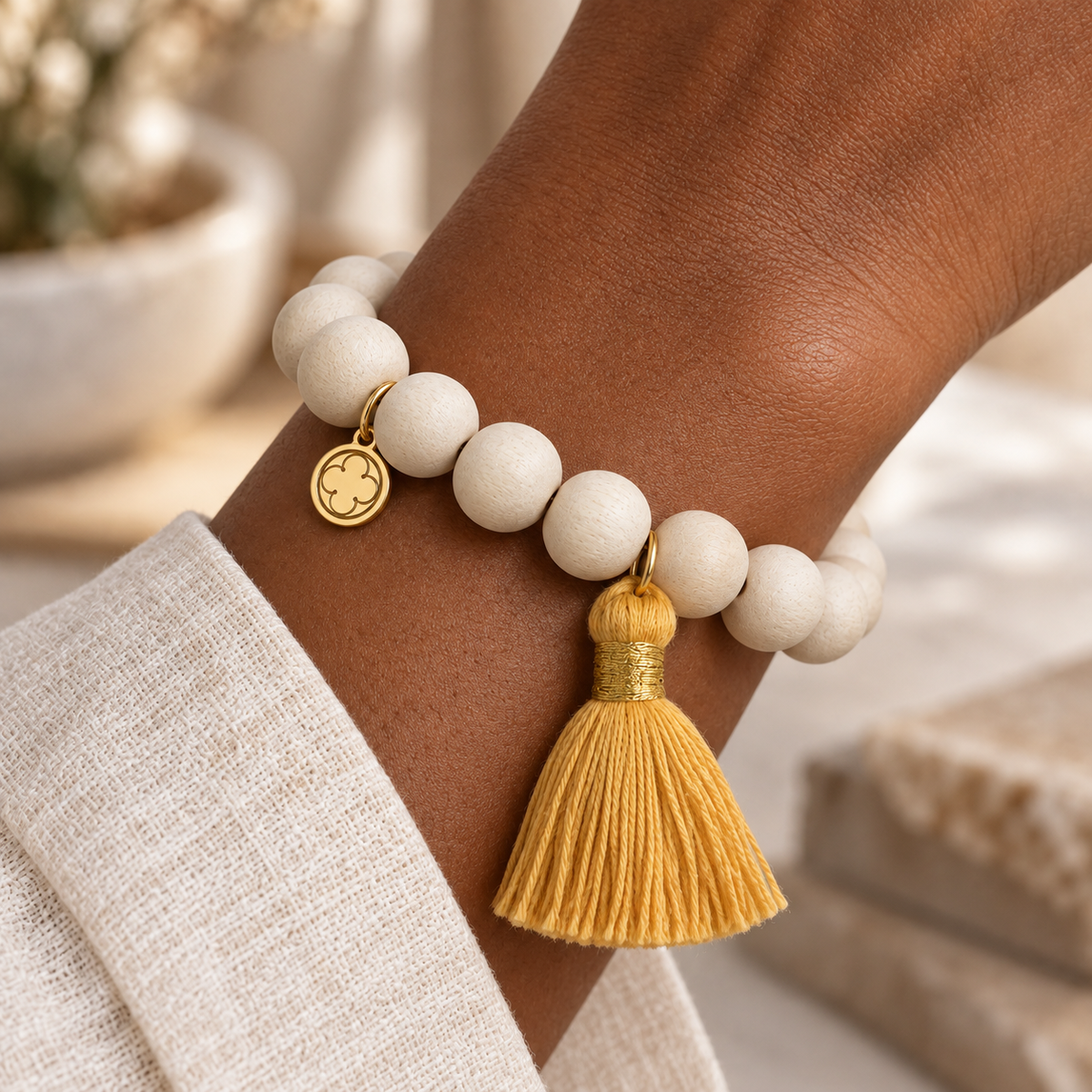 Blonde Wood with Buttercup Tassel worn on wrist