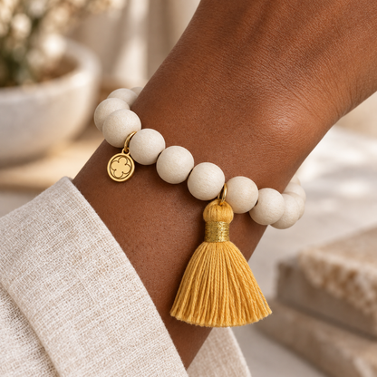 Blonde Wood with Buttercup Tassel worn on wrist