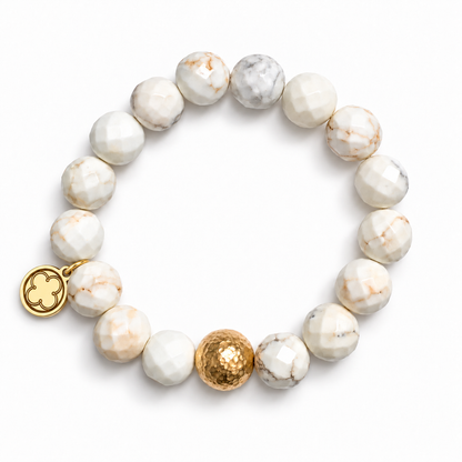 White Magnesite with Hammered Gold Accent with signature logo tag between the third and fourth beads
