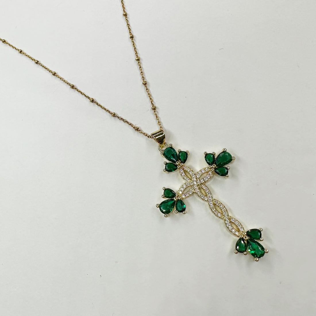 Emerald Pavè Twisted Cross Necklace